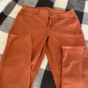 Large pair of Rockstar jeans by Maurices.  More of a terracotta than orange.